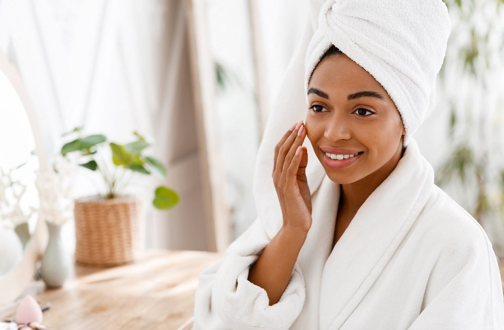 Woman applying anti-aging cream